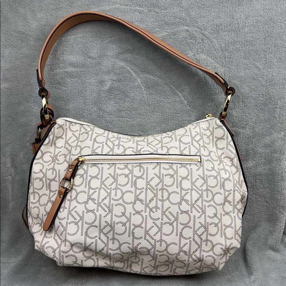 Calvin Klein Logo Print Hobo Bag in Cream and Brown
